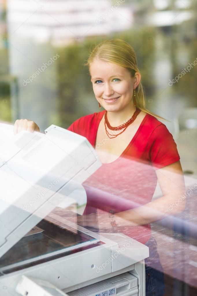 Female student with using a copy machine