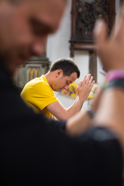 Man praying in a church