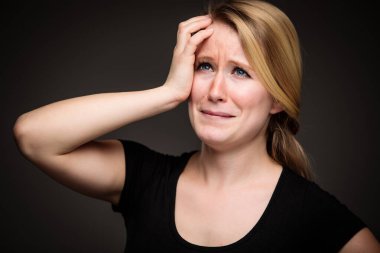 Remorse, Regrets, Fear, Anxiety, Uncertainty in a young woman - effects of a difficult life situation - vivid emotions concept