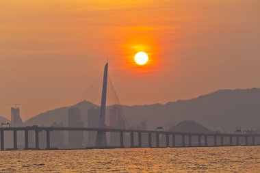 Sunset bridge in Hong Kong clipart