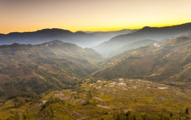 Yuanyang rice terraces sunset in Yunnan, China. clipart