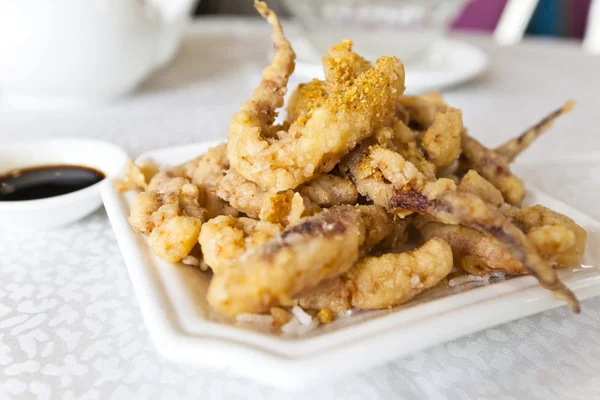 Plate of fried calamari served with sauce — Stock Photo, Image