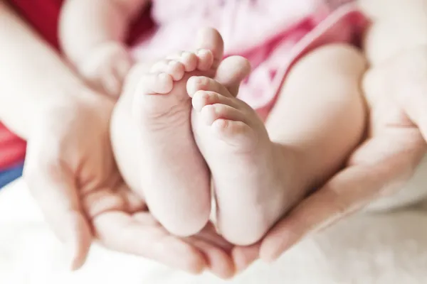 A close-up of tiny baby feet — Stock Photo, Image