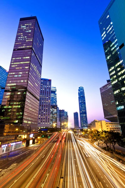 Traffic in downtown at sunset — Stock Photo, Image