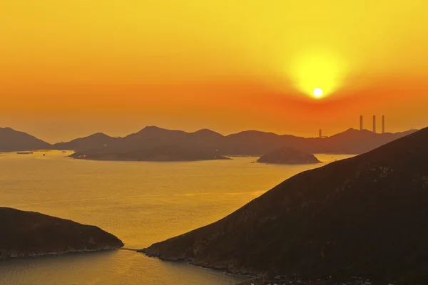 Sunset power plant at coast — Stock Photo, Image