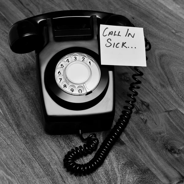 Black retro telephone with reminder note — Stock Photo, Image