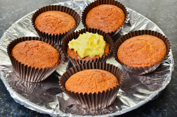 Home made chocolate cupcakes with lemon icing — Stock Photo, Image