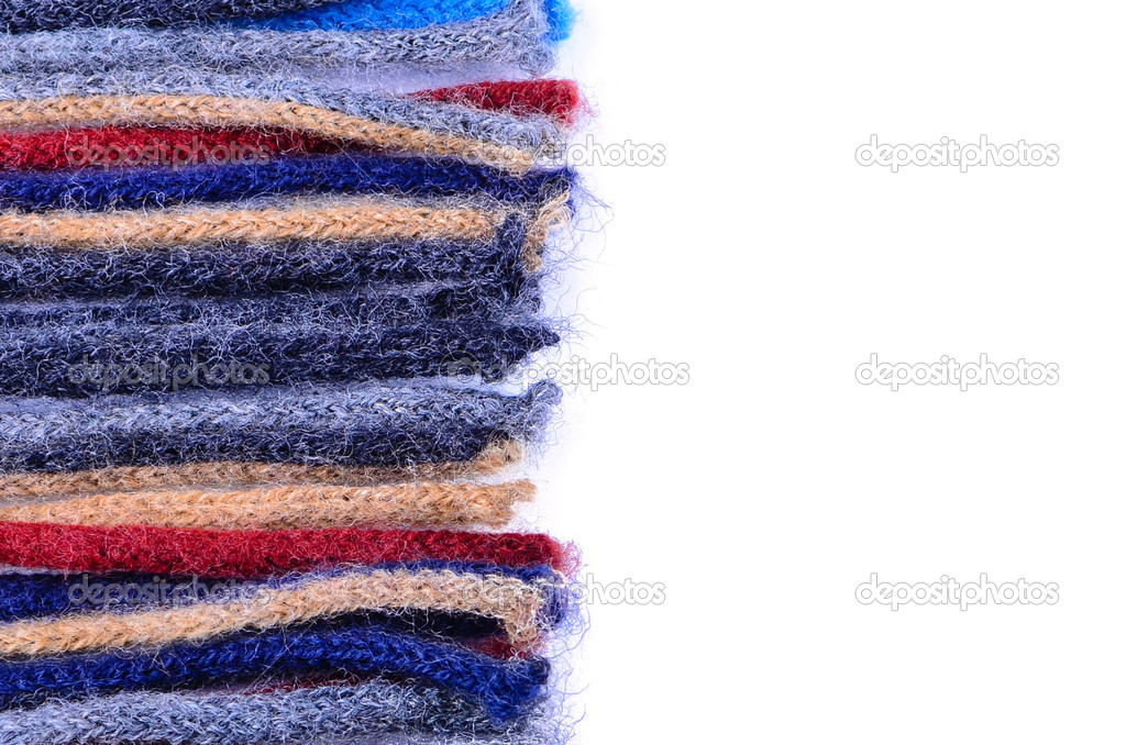 Coloured woolen threads on a white background