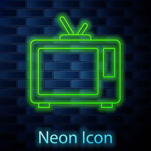 Gloeiende neon lijn Retro tv icoon geïsoleerd op bakstenen muur achtergrond. Televisieteken. Vector — Stockvector