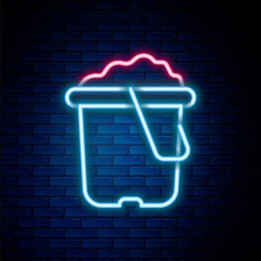 Parlayan neon çizgisi, tuğla duvar arka planında izole edilmiş kova simgesi. Plastik çocuk oyuncağı. Yaz ikonu. Renkli taslak konsepti. Vektör