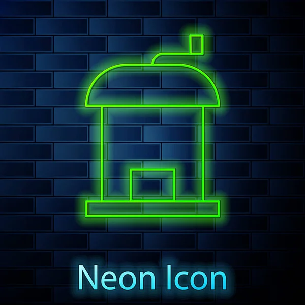 Gloeiende neon lijn Handmatige koffiemolen pictogram geïsoleerd op baksteen muur achtergrond. Vector — Stockvector