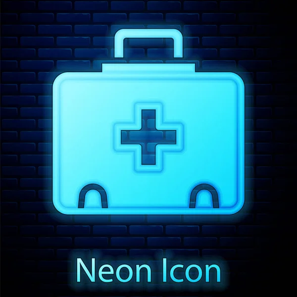 Glowing Neon First Aid Kit Icon Isolated Brick Wall Background — Stock Vector