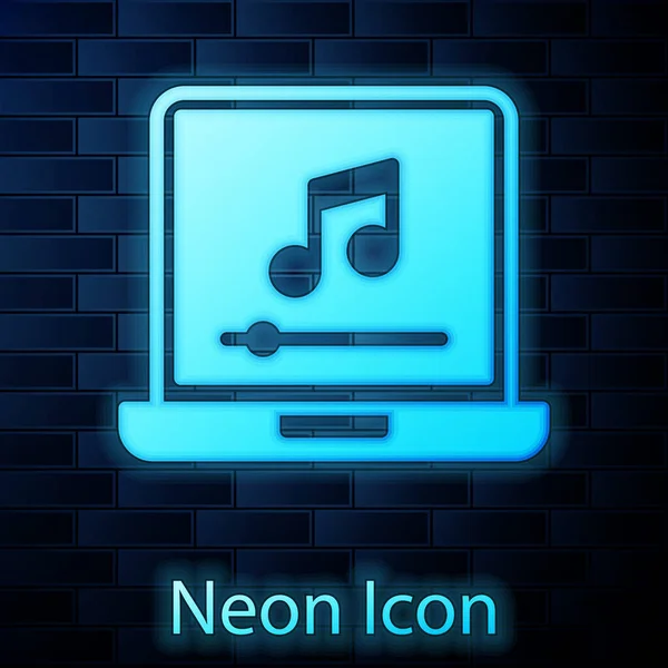 Brillante ordenador portátil de neón con símbolo de nota de música en el icono de la pantalla aislado en el fondo de la pared de ladrillo. Vector — Vector de stock