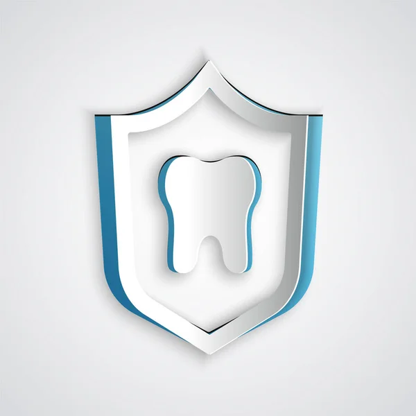 Kağıt kesiği diş koruma simgesi gri arkaplanda izole edildi. Kalkan logosunda diş. Kağıt sanatı tarzı. Vektör — Stok Vektör