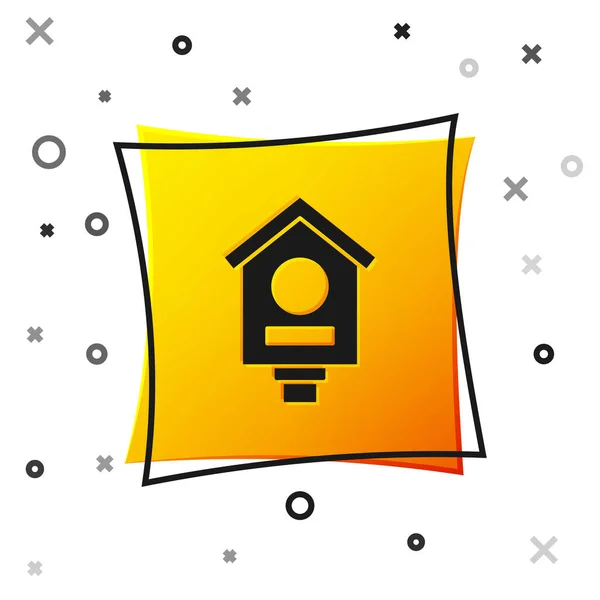 Black Bird house icon isolated on white background. Nesting box birdhouse, homemade building for birds. Yellow square button. Vector — Stockvektor