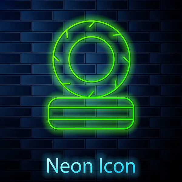 Glowing neon line Lying burning tires icon isolated on brick wall background. Vector — Stok Vektör