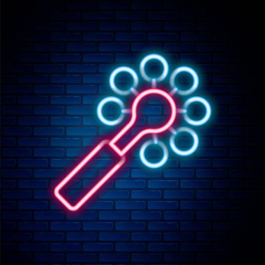 Parlayan neon hattı, oyuncak bebek oyuncağı ikonu tuğla duvar arka planında izole edildi. Fasulye torbası işareti. Renkli taslak konsepti. Vektör