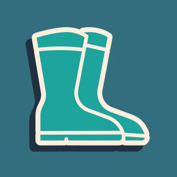 Green Fishing boots icon isolated on green background. Waterproof rubber boot. Gumboots for rainy weather, fishing, hunter, gardening. Long shadow style. Vector — Stock Vector