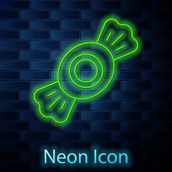 Gloeiende neon lijn Candy icoon geïsoleerd op bakstenen muur achtergrond. Vector — Stockvector