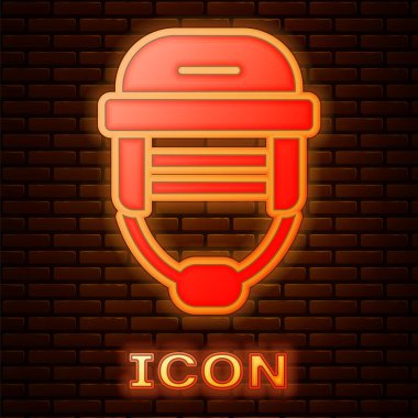 Parlayan neon hokey başlığı simgesi tuğla duvar arkasında izole edilmiş. Vektör.