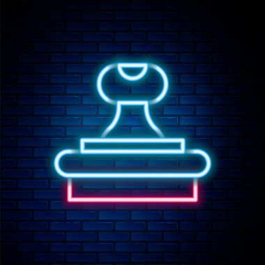 Parlayan neon hattı pul ikonu tuğla duvar arka planında izole edildi. Renkli taslak konsepti. Vektör.