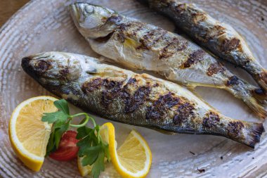 Grilled bluefishes in restaurant in Sozopol on Black Sea coast in Bulgaria clipart
