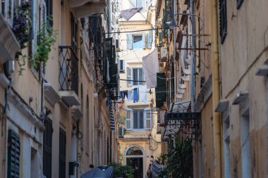 Narrow alley with residential building in historic part of Corfu city, capital of Corfu Island, Greece clipart