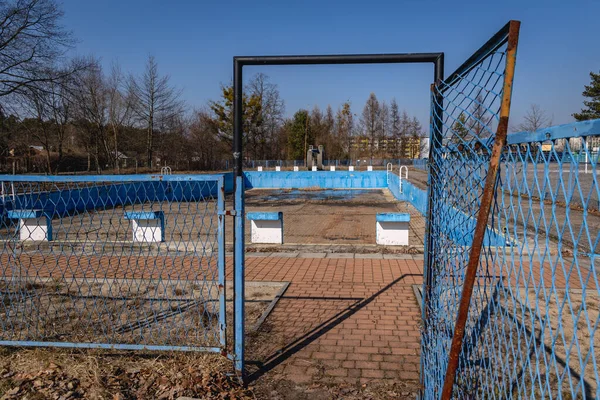 Fence around abandoned swimming pool in Nowa Deba town in Poland