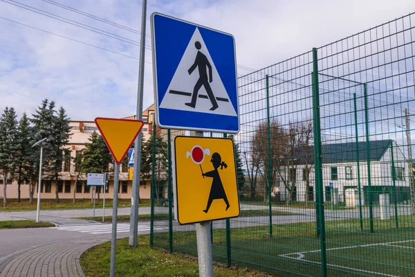 Pedestrian crossing and Children Crossing signs in Rogow village, Lodz Province, Poland