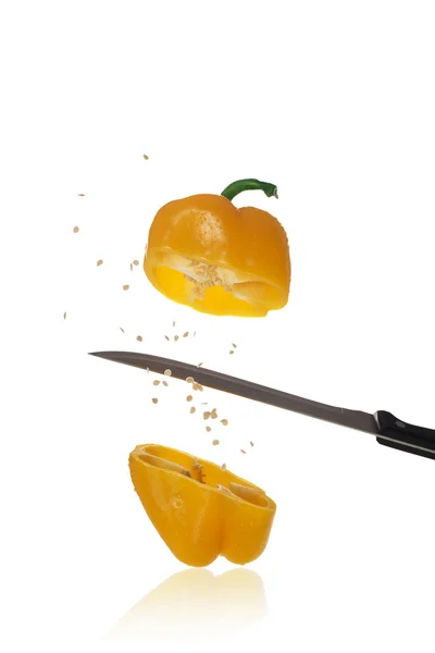 Yellow Paprika is knifed at with seeds — Stock Photo, Image
