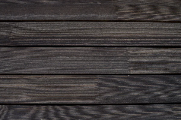 Barras de madera marrón un fondo —  Fotos de Stock