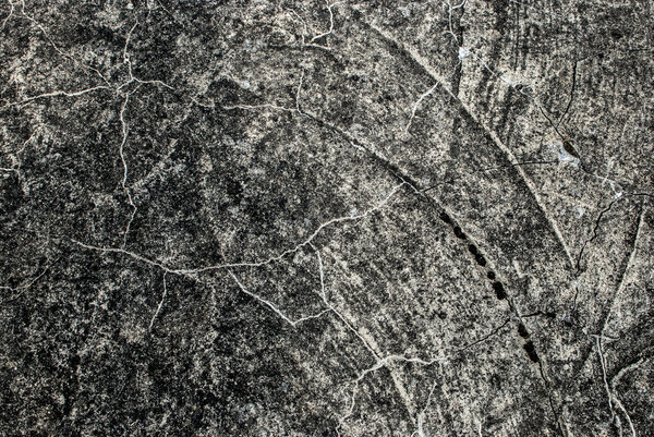 background from a gray rough surface of stone