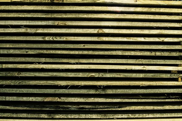 Horizontally lying wooden old bars — Stock Photo, Image