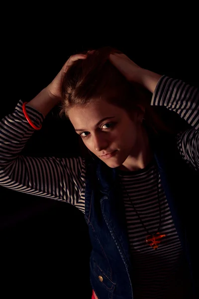 Beautiful thoughtful girl close up in the dark — Stock Photo, Image