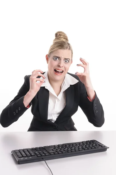 Young woman sitting at the computer annoyed — Stock Photo, Image