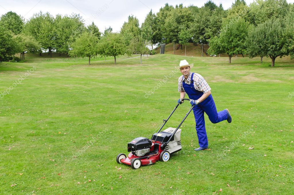Gardening, man mowing the lawn Stock Photo by ©runzelkorn 20429127