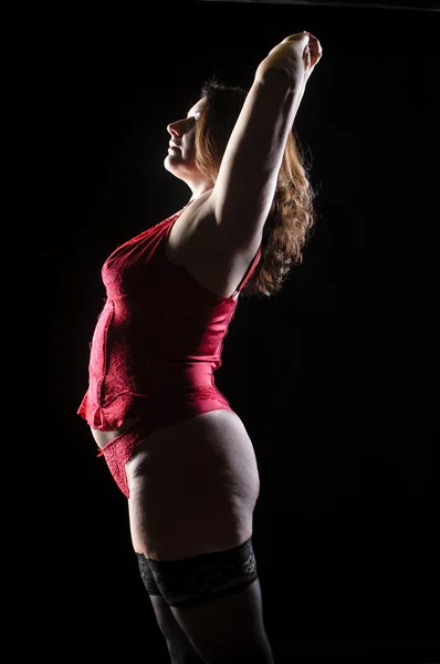 Mulher lingerie vermelha lateralmente — Fotografia de Stock
