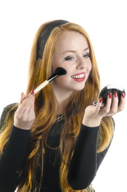 Young girl doing rouge