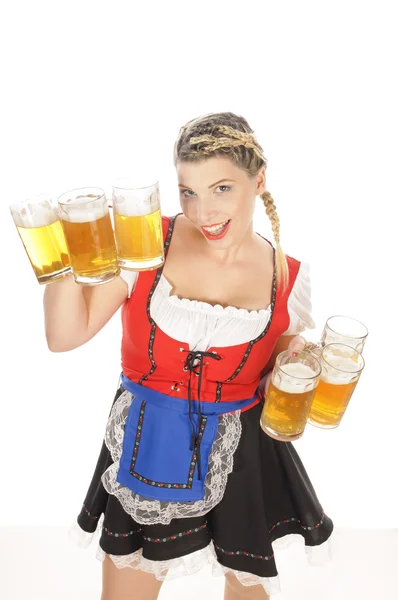 Oktoberfest, young waitress in dirndl with many beer mugs — Stock Photo, Image