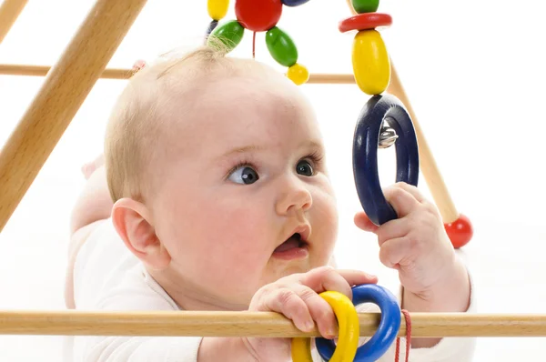 Baby grabbing toy — Stock Photo, Image