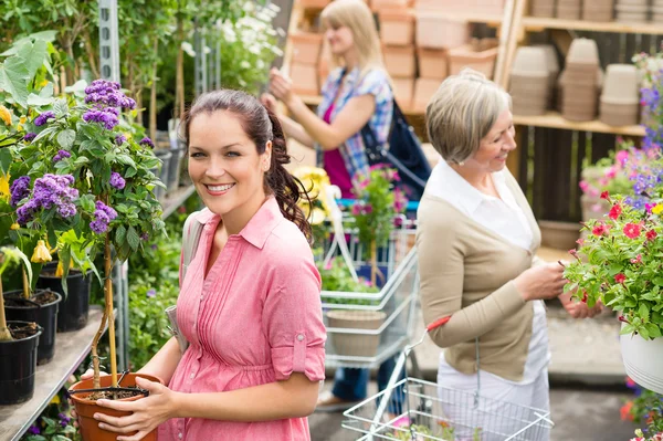 Woman hold potted plant at garden shop Royalty Free Stock Images