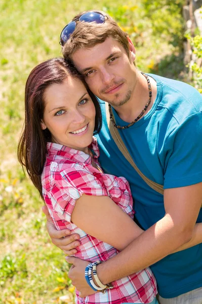 Happy affectionate young couple hugging in park Stock Photo