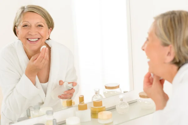 Senior woman smiling bathroom mirror reflection — Stock Photo, Image