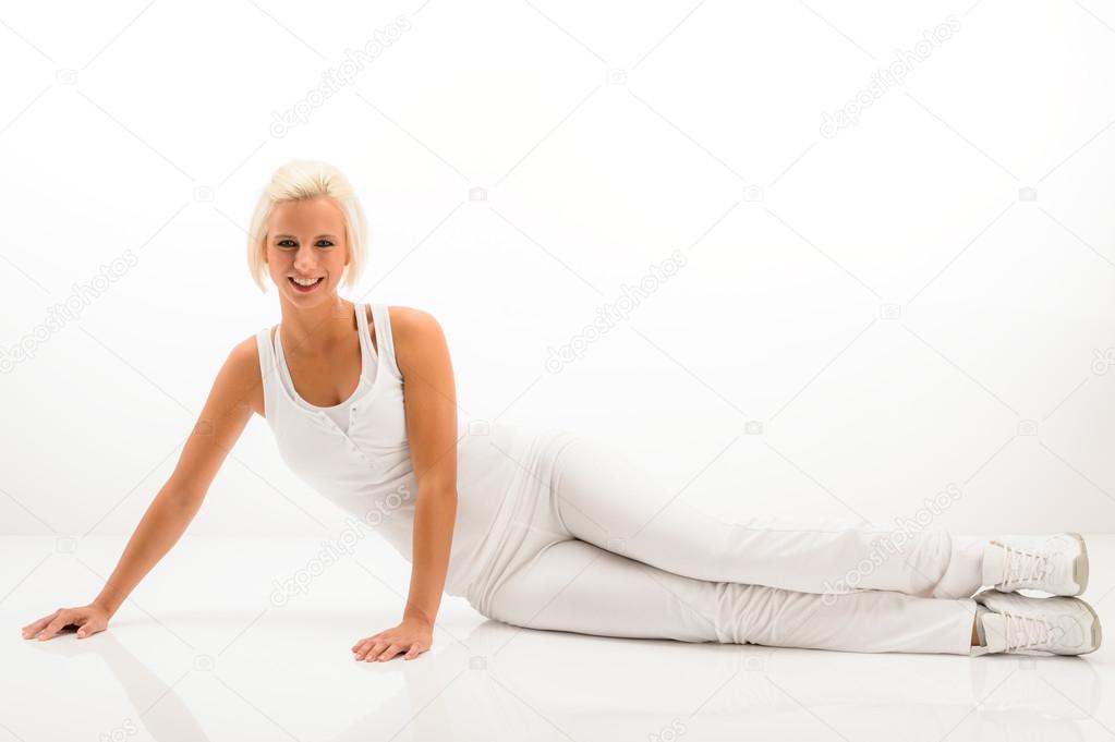 Fitness woman stretch body at Pilates exercise