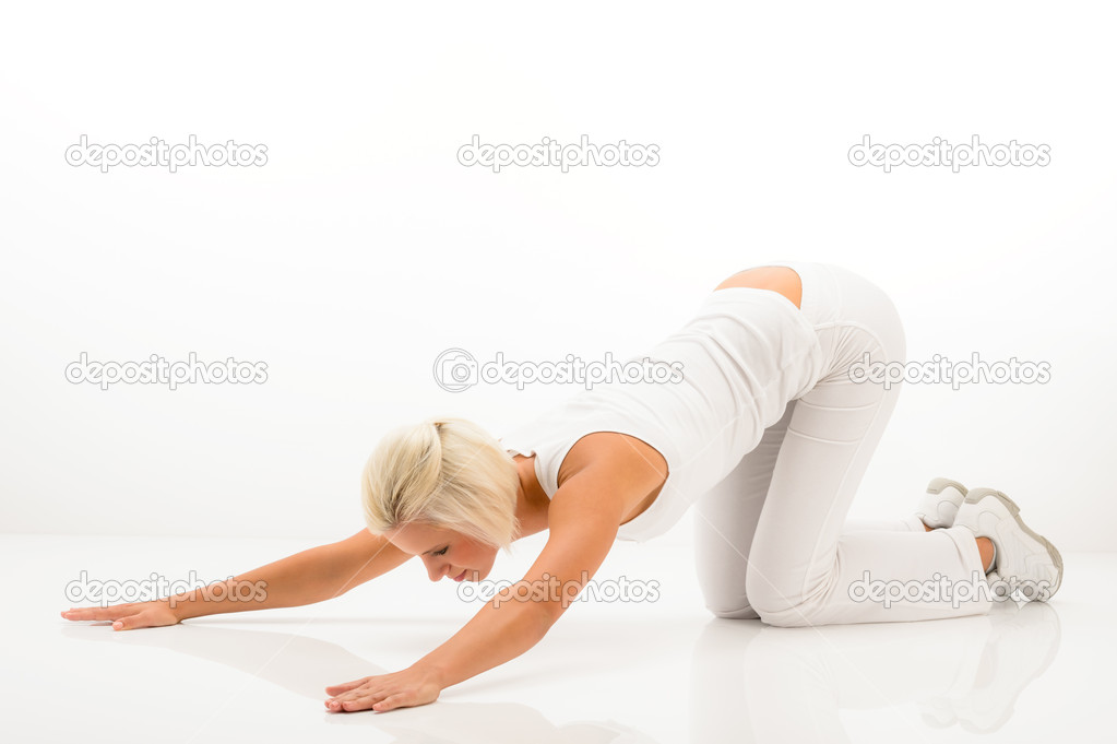 White fitness woman stretch body at Pilates