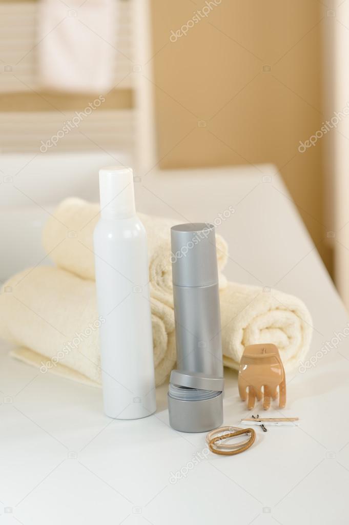 Hair care products and towels close-up