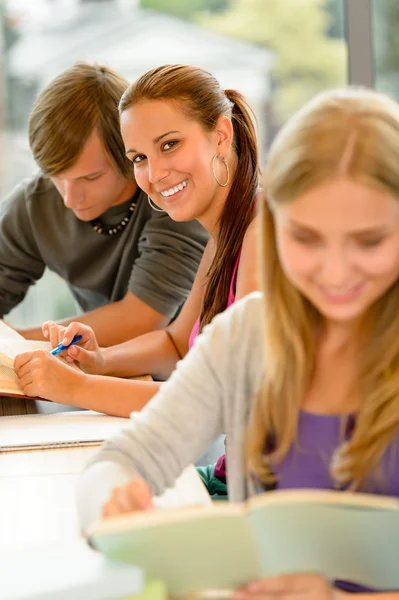 Teens study in high-school library reading student Royalty Free Stock Photos