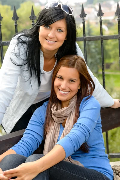 Mother and daughter in the park smiling Royalty Free Stock Photos