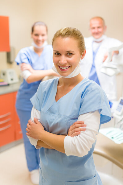 Smiling nurse dental team in stomatology clinic