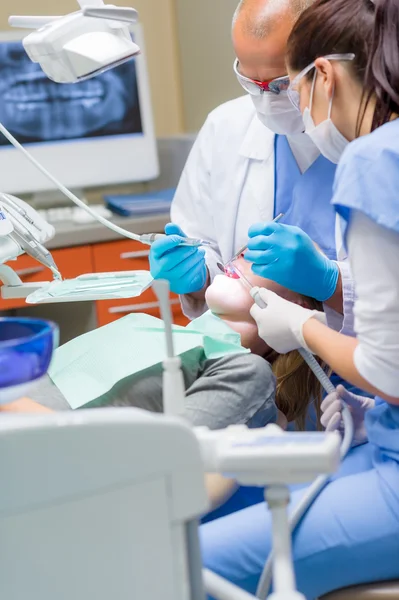 Woman at dentist surgery have treatment Royalty Free Stock Images